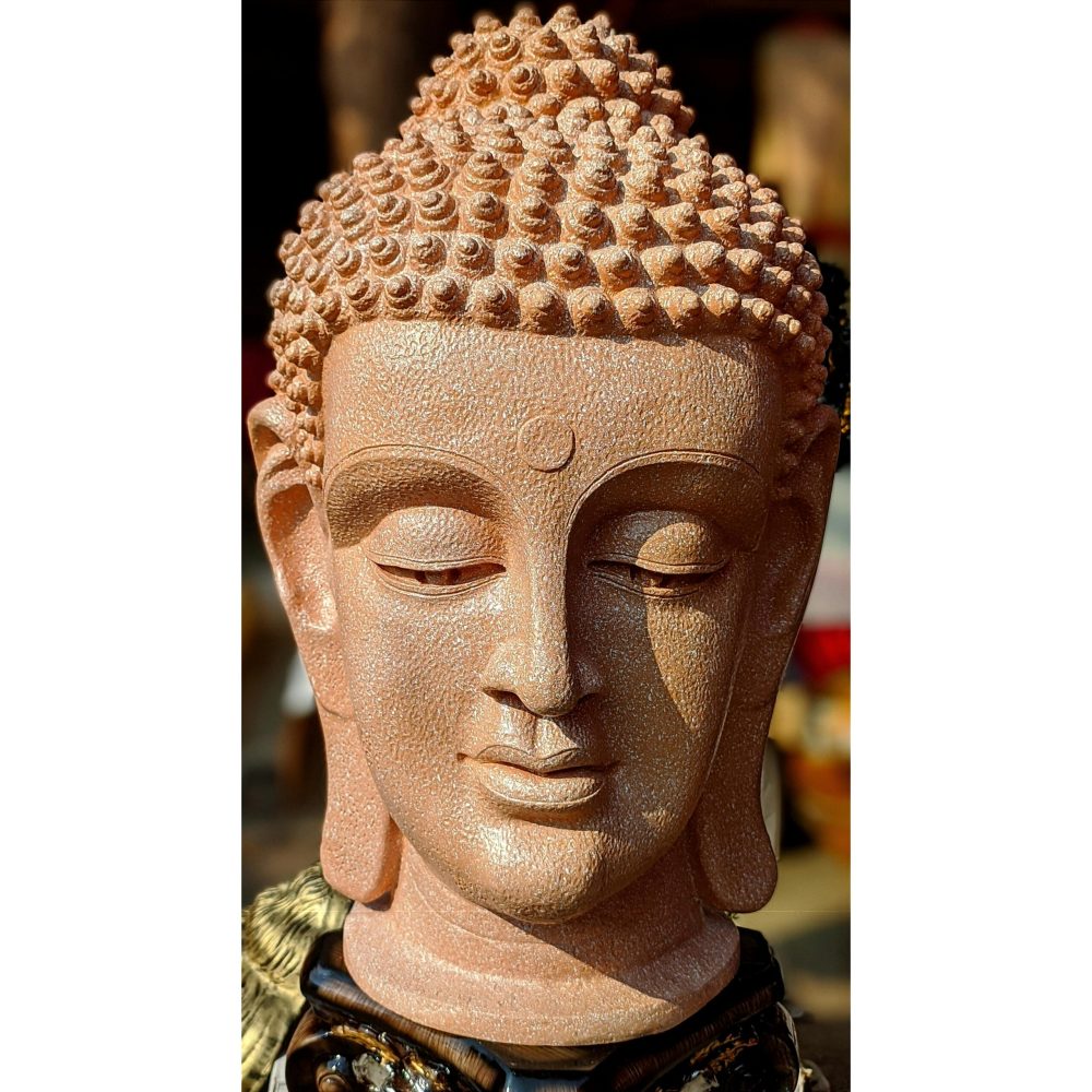 A serene close-up of a Buddha statue capturing its intricate details and peaceful expression.