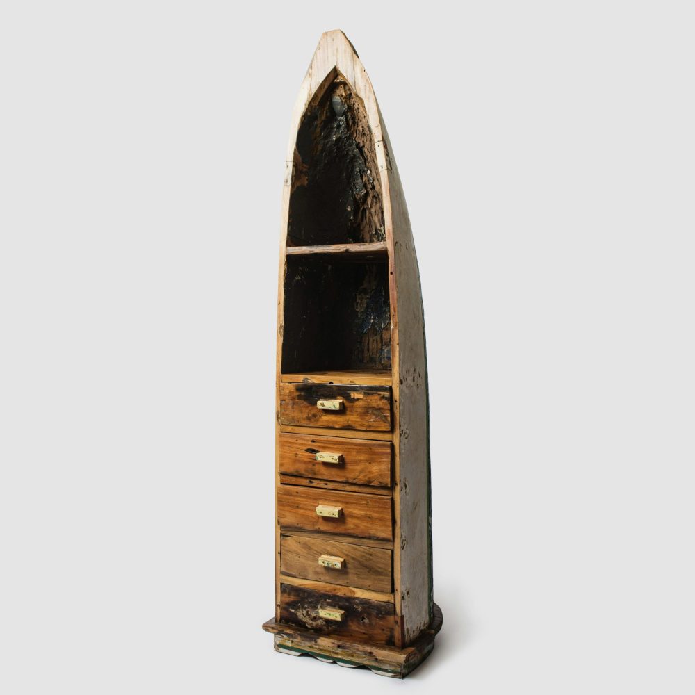 Antique-inspired boat-shaped cabinet with drawers on a white background.